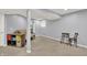 Basement with futon, storage, and neutral colored walls and carpet at 3740 Weather Stone Xing, Zionsville, IN 46077