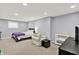 Finished basement bedroom with bed, lounge chair, and natural light at 3740 Weather Stone Xing, Zionsville, IN 46077