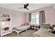 Bright room with two twin beds, ceiling fan, plush carpet, and side tables at 3740 Weather Stone Xing, Zionsville, IN 46077