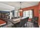 Charming dining room with rustic table, seating for eight, modern lighting, and open layout at 3740 Weather Stone Xing, Zionsville, IN 46077