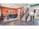 Elegant dining room featuring hardwood floors and a staircase with a wood banister at 3740 Weather Stone Xing, Zionsville, IN 46077