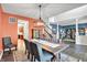 Open-concept dining room offers seating for eight, stylish decor, and seamless flow at 3740 Weather Stone Xing, Zionsville, IN 46077