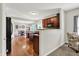 An open concept kitchen featuring a serving bar and hardwood floors at 3740 Weather Stone Xing, Zionsville, IN 46077