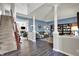 Inviting living room with hardwood floors, staircase, and comfortable seating at 3740 Weather Stone Xing, Zionsville, IN 46077