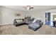 A comfortable living room with an oversized sectional sofa and natural lighting at 3740 Weather Stone Xing, Zionsville, IN 46077