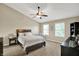Spacious main bedroom with vaulted ceiling, ceiling fan, carpet, and plenty of natural light at 3740 Weather Stone Xing, Zionsville, IN 46077