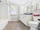 Well-lit bathroom with a tub, shower, and large vanity providing ample storage and functionality at 3809 N Glenwood Ave, Muncie, IN 47304