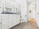 This bathroom has tiled floors, a white vanity, and toilet at 3809 N Glenwood Ave, Muncie, IN 47304