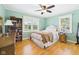 The primary bedroom has a ceiling fan and two windows at 3809 N Glenwood Ave, Muncie, IN 47304