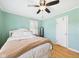 This bedroom features wood floors and a ceiling fan at 3809 N Glenwood Ave, Muncie, IN 47304