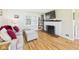 Cozy living room with hardwood floors and a charming fireplace at 3809 N Glenwood Ave, Muncie, IN 47304