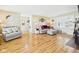 Bright living room featuring hardwood floors and neutral-toned furniture at 3809 N Glenwood Ave, Muncie, IN 47304