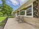 Inviting front porch with decorative details and a serene view at 3809 N Glenwood Ave, Muncie, IN 47304