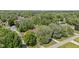 Aerial view of a home nestled among trees in a residential neighborhood at 396 W 500 S, Anderson, IN 46013