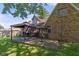 Outdoor wooden deck with gazebo, offering an ideal spot for relaxation and outdoor entertaining in a well-maintained backyard at 396 W 500 S, Anderson, IN 46013