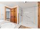 Bright bathroom featuring a step-in shower with handicap accessibility features and a double sink vanity at 396 W 500 S, Anderson, IN 46013