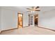 Neutral bedroom showcasing doors leading to a bathroom and the charming living room at 396 W 500 S, Anderson, IN 46013