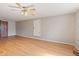 Large bonus room featuring hardwood floors, neutral walls, and ceiling fan at 396 W 500 S, Anderson, IN 46013