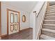 Foyer with hardwood floors, a staircase, and a decorative front door with leaded glass at 396 W 500 S, Anderson, IN 46013