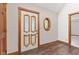 Bright foyer with decorative door, beautiful trim and hardwood floors at 396 W 500 S, Anderson, IN 46013