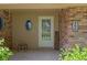 Cozy front porch with unique oval window, providing a welcoming entry to the home at 396 W 500 S, Anderson, IN 46013