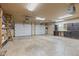 Spacious garage with overhead lighting, built-in cabinets and shelving at 396 W 500 S, Anderson, IN 46013