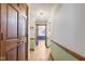 Hallway featuring hardwood flooring, neutral walls, and wooden trim at 396 W 500 S, Anderson, IN 46013