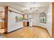 Bright kitchen with hardwood floors, granite countertops, and a cozy seating area at 396 W 500 S, Anderson, IN 46013