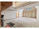 Open living room with vaulted ceilings, fireplace, and carpet flooring at 396 W 500 S, Anderson, IN 46013