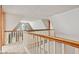 Bright loft area featuring a charming window with railing and neutral carpet at 396 W 500 S, Anderson, IN 46013