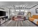 Basement living room features a comfy couch and ample space at 4046 N Park Ave, Indianapolis, IN 46205