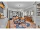 Elegant dining room featuring wood floors, rug, and modern light fixture at 4046 N Park Ave, Indianapolis, IN 46205