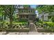 Charming two-story home with a beautifully landscaped front yard and welcoming front porch at 4046 N Park Ave, Indianapolis, IN 46205