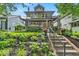 Beautiful home with landscaped front yard, charming porch, and welcoming curb appeal at 4046 N Park Ave, Indianapolis, IN 46205