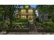 Lovely home with mature trees and a beautifully landscaped front yard enhancing its curb appeal at 4046 N Park Ave, Indianapolis, IN 46205