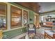 Relaxing front porch featuring comfortable seating and charming decor at 4046 N Park Ave, Indianapolis, IN 46205