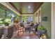 Spacious front porch with comfortable seating and stylish outdoor decor at 4046 N Park Ave, Indianapolis, IN 46205