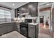 Well-lit kitchen featuring gray cabinets and a modern gas range at 4046 N Park Ave, Indianapolis, IN 46205