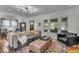 Cozy living room with a comfortable sofa, modern lighting, and large windows at 4046 N Park Ave, Indianapolis, IN 46205