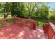 Spacious back deck with stairs leading down to the grassy backyard at 4291 Caledonia Way, Indianapolis, IN 46254