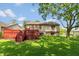 Lush backyard with a wooden deck overlooking the green lawn, perfect for outdoor enjoyment at 4291 Caledonia Way, Indianapolis, IN 46254