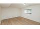 Basement with a window, neutral walls, and hardwood floors at 4291 Caledonia Way, Indianapolis, IN 46254