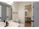 Bathroom with updated vanity, toilet, mirror, and tile shower at 4291 Caledonia Way, Indianapolis, IN 46254