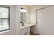 Bathroom with a vanity, window, and sliding door closet at 4291 Caledonia Way, Indianapolis, IN 46254