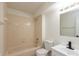 Well-lit bathroom featuring a shower-tub combo, modern toilet, and a sleek white vanity at 4291 Caledonia Way, Indianapolis, IN 46254