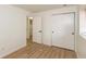 Bedroom featuring modern flooring and an adjoining closet with sliding doors at 4291 Caledonia Way, Indianapolis, IN 46254