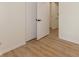 Bright bedroom featuring modern flooring and a convenient doorway to another room at 4291 Caledonia Way, Indianapolis, IN 46254