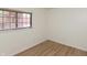 Bedroom with a large window and lovely flooring, providing natural light and style at 4291 Caledonia Way, Indianapolis, IN 46254