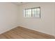 Bedroom featuring neutral paint, hardwood floors, and a window at 4291 Caledonia Way, Indianapolis, IN 46254