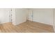 Neat bedroom with laminate flooring, a spacious closet, and neutral walls at 4291 Caledonia Way, Indianapolis, IN 46254